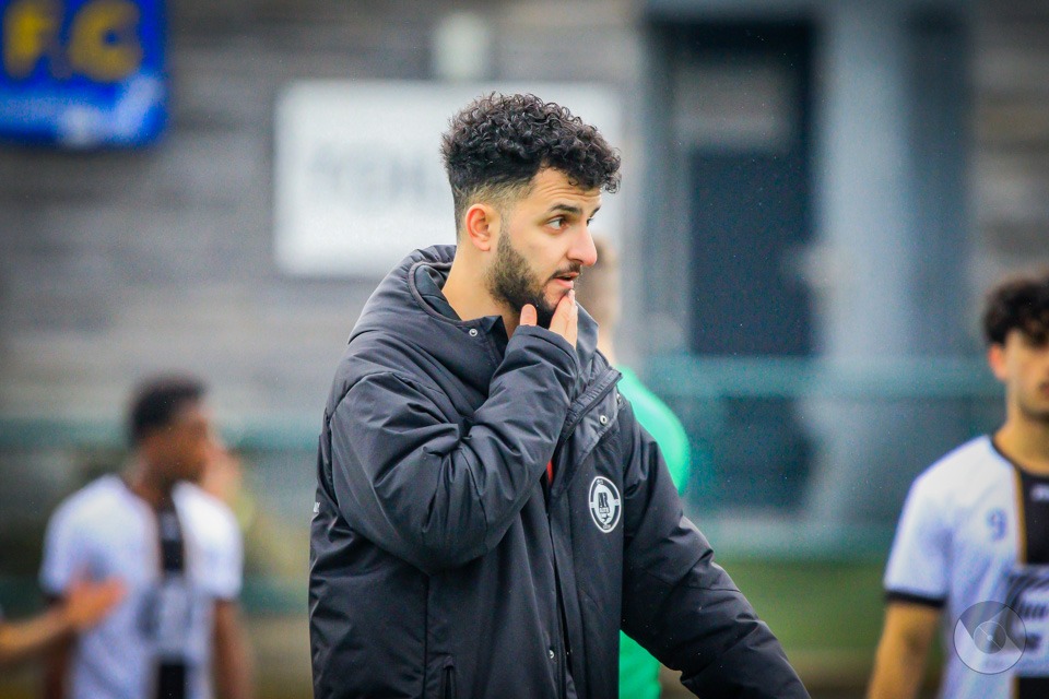 AR Elite Academy coach on the touchline, thinking through the next substitution